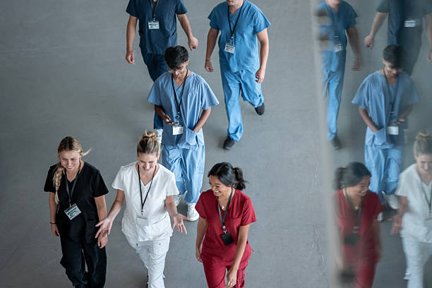 istock Healthcare Professionals Walking as a Group in a Hallway 2232580278