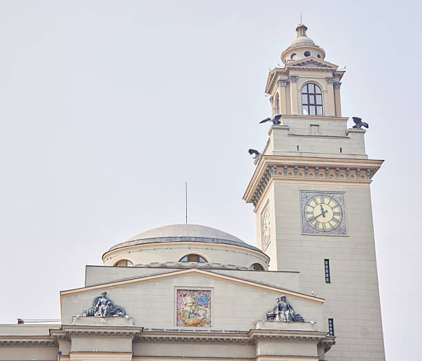 White clock tower, blue sky and white clouds, architectural photography