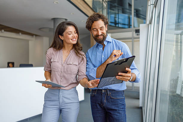 istock Business people discussing work using digital tablet and clipboard 2232581283