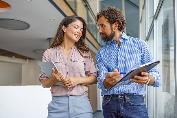 istock Business colleagues discussing work using digital tablet and clipboard 2232581305