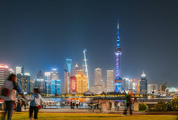 Pudong Skyline by night, Shanghai, China. Skyline of Pudong as seen from the Bund, with landmark Oriental Pearl tower and Jin Mao tower, Shanghai, China. The word \