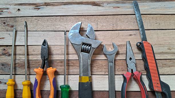 istock Tool set arrangement on wooden surface 2232585222