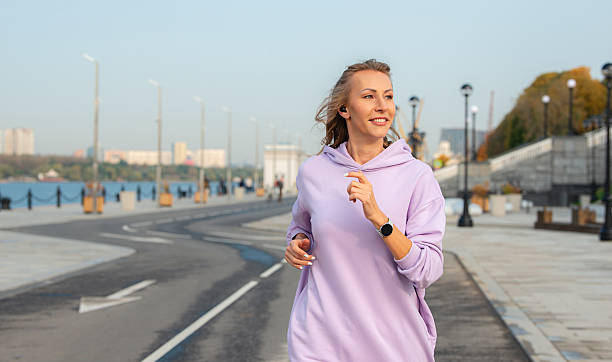 istock A girl jogging in the park. 2232586447