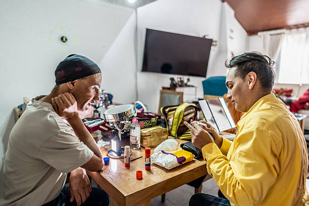 Mature drag queen putting on makeup at home