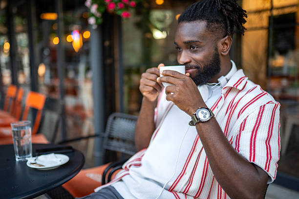 istock African American man taking a break and enjoying a coffee in a caffe 2232599461