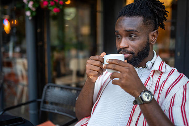 istock African American man taking a break and enjoying a coffee in a caffe 2232599495