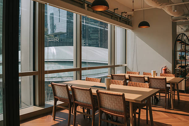 istock Modern coworking flexible workstation with large windows and Kuala Lumpur skyline view 2232602231