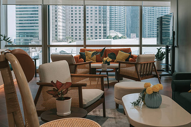 istock Modern coworking lounge with stylish seating and city view through large windows 2232602271