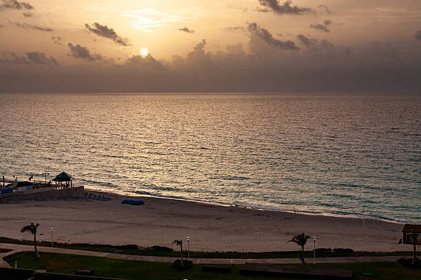 istock Golden Sunrise over Cancun Beach 2232606142