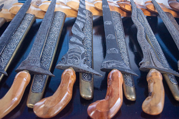 istock Beautifully crafted keris daggers with wooden handle and sheath. 2232606432