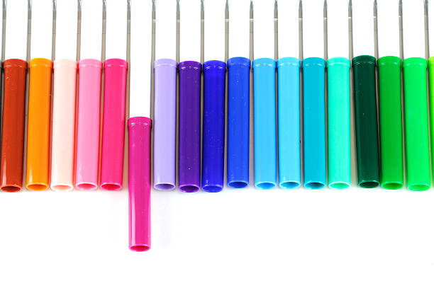 istock colorful markers in a row isolated on white background 2232609028