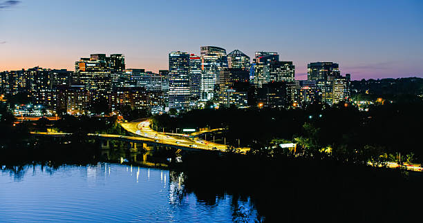 Helicopter shot of Arlington and Rosslyn, Virginia at night from above the Potomac River.