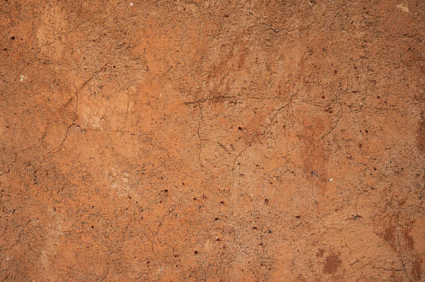 istock Full frame shot of an earthen wall texture of clay house structure. 2232612809