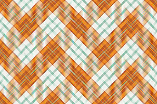 istock Seamless plaid pattern. Tartan texture in orange, green,  white hues. Ideal for fabric, backgrounds, or graphic designs. Versatile, cozy, and timeless. 2232616527