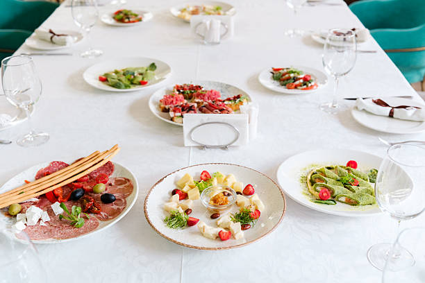 istock Elegant dining setup featuring a variety of gourmet dishes at a table 2232616741