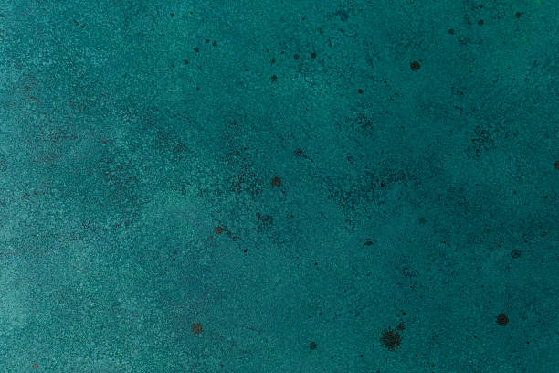 istock Textured teal wall with subtle paint speckles and aged effect 2232616812