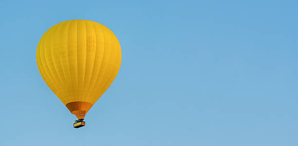istock Yellow hot air balloon in cloudless sky. Banner. Space for text 2232616831