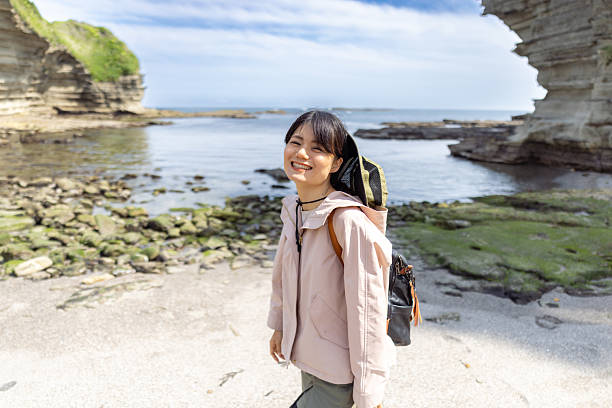 istock Woman in barefoot walking in empty beach 2232618217