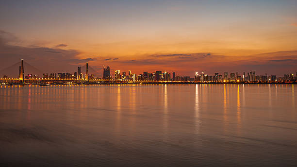 istock Twilight background of sunset over the modern urban waterfront skyline 2232622696