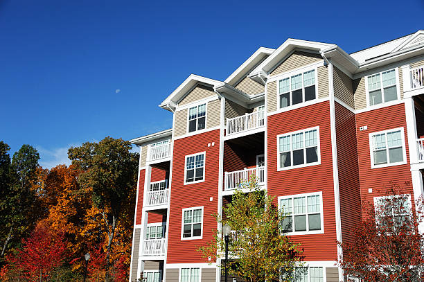 colorful apartment buildings and green front lawn in spring