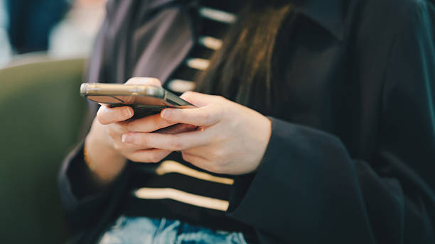 istock young person woman using smartphone texting on mobile phone digital communication technology 2232624949