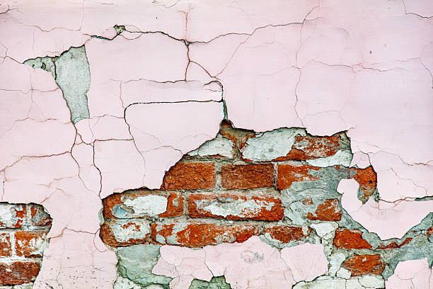 istock A brick wall with a pink and white paint job 2232631684