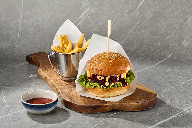 istock Beef burger with bbq sauce, bright mood, flatlay on marble background 2232639522