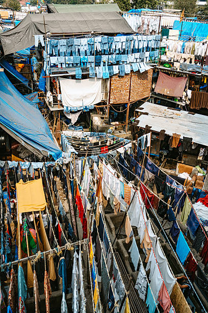 Vibrant outdoor laundry drying in Mumbai, showcasing colorful garments hanging in a traditional washing space. Dhobi Ghat is a open air laundry in Mumbai city.