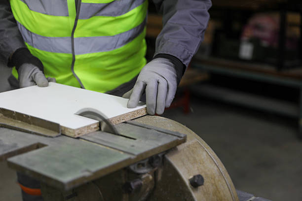 istock Carpenter Cutting Wood with Circular Saw for Construction Project 2232642282