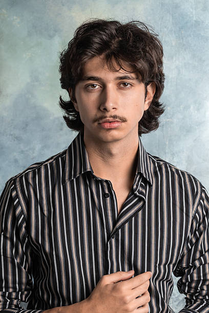 Vertical portrait of a young boy with a retro look