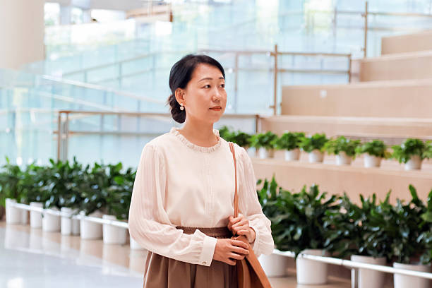 istock An Asian woman in the library 2232644625