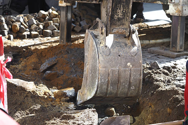 istock Excavation work in urban area for infrastructure repairs 2232646274