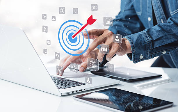 istock Business professional using laptop and tablet with virtual target icon or set goal concept.Tool of strategy and plans for business development. 2232646853