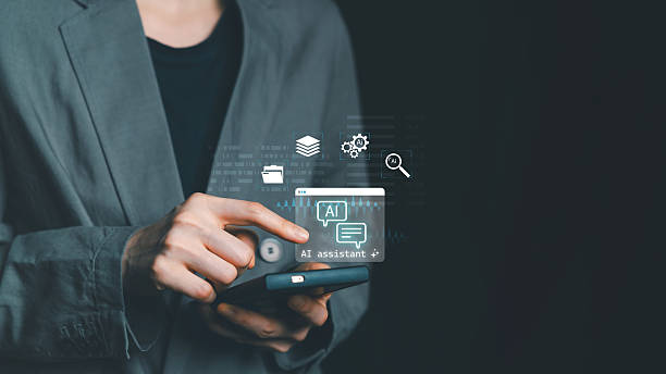 istock Businessman using smartphone with AI assistant icons. Concept of virtual assistant, chatbot, artificial intelligence interaction, and smart communication for business automation. 2232647856