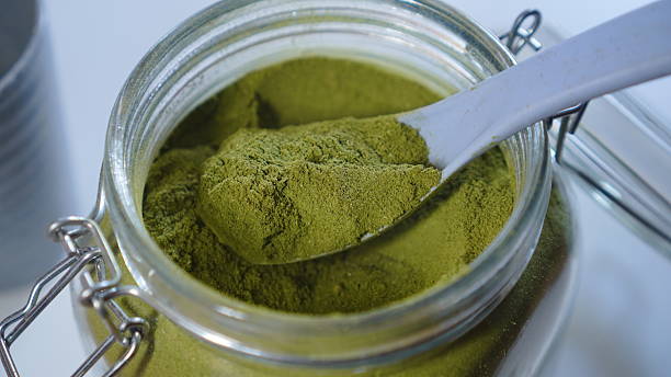 istock Organic Moringa Oleifera Powder in Glass Jar with Spoon 2232648110
