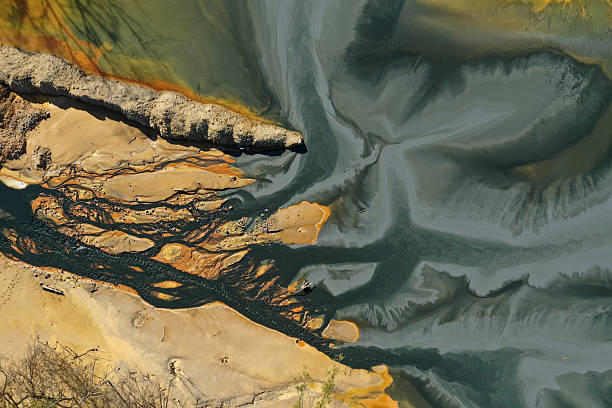 istock Flying over patterns of acid mine drainage in decanting lake aerial 2232648295