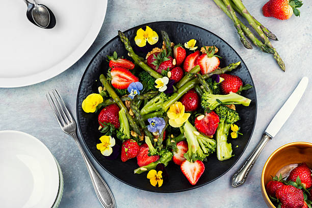 istock Mixed salad with green asparagus, strawberries. 2232649901