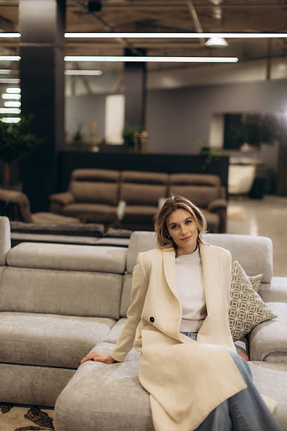 istock Stylish Woman Relaxing on a Modern Sofa in a Chic Interior Setting 2232652161