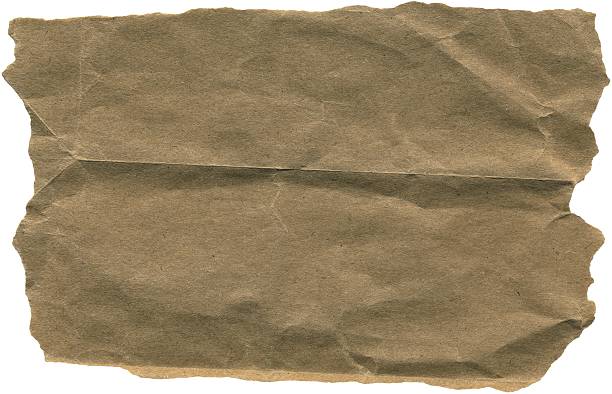 istock Kraft ripped piece. Brown wrinkled kraft paper sheet for background, packaging, gift wrapping, and creative crafting projects 2232657198