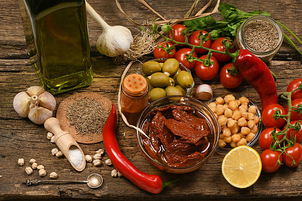 Various herbs and spices for hummus on wooden background. High resolution photo. Full depth of field.