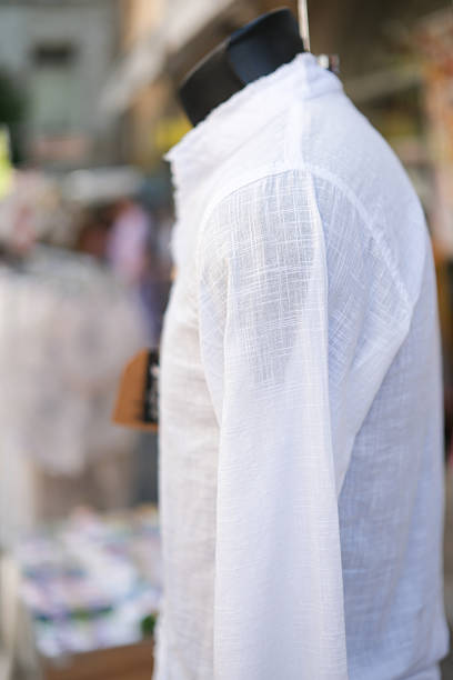 White cotton or linen shirt on the mannequin. Conscious consumption, sustainable lifestyle. Stylish look for relaxation, walks, and cultural tourism. Shallow depth of field.
