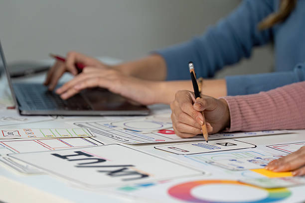 istock Hands on UX and UI design process with sketches and laptop 2232658521