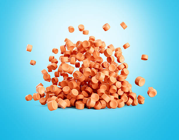 istock Orange Plastic Pellets Or PVC Polymer Beads Falling On Blue Background 3d Illustration 2232661081