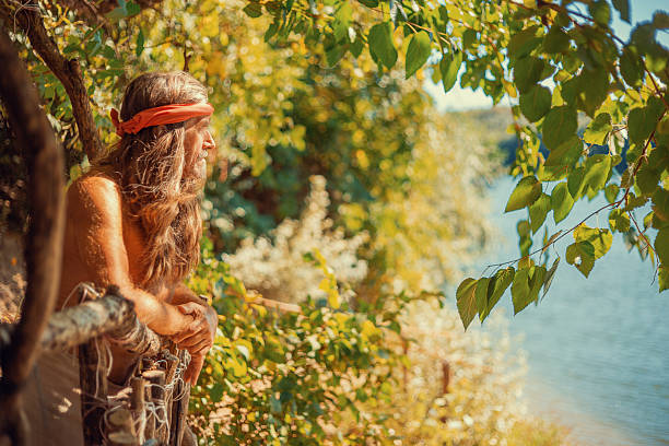 Hermit enjoying the view of the river in the forest