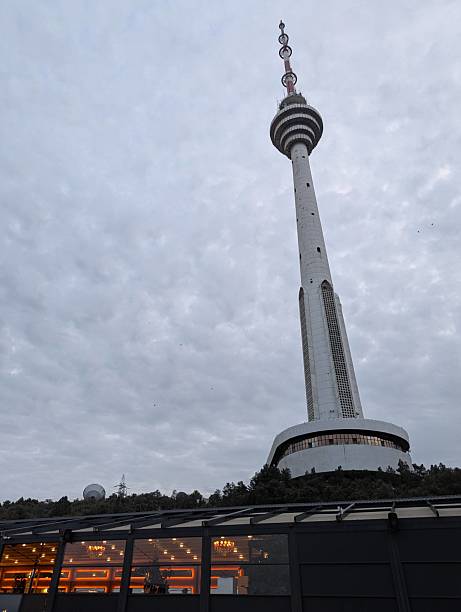 istock Striking Television Tower Against Overcast Sky with Restaurant Below 2232662800