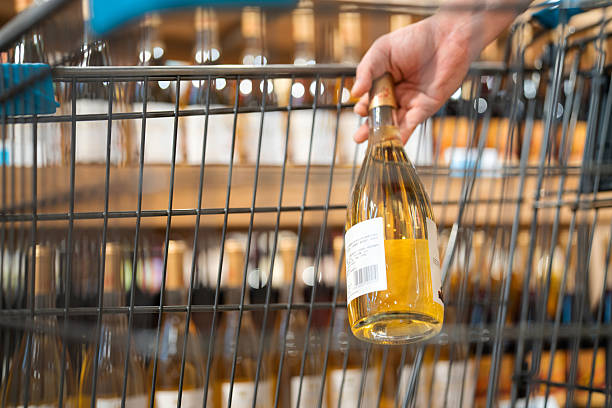 istock Asian man buying wine in supermarket 2232665364