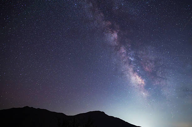 istock Beautiful bright Milky Way galaxy  over the hill.  Night sky astronomical background. 2232665726