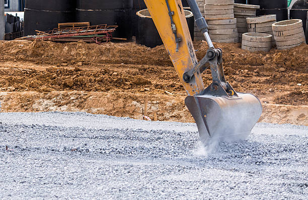istock An excavator on a construction site in close-up. The excavator rams the crushed stone with a bucket for construction. Heavy machinery for construction and landscaping. 2232667283