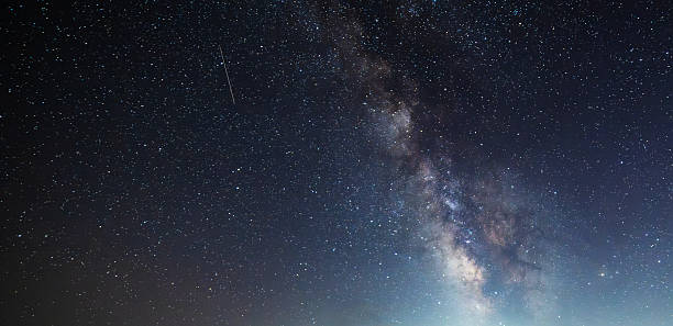 istock Beautiful bright Milky Way galaxy on the starry sky.  Night sky astronomical background. 2232668346