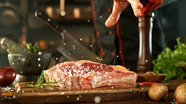 istock Delicious beef steak on wooden table 2232668746